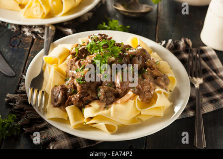 Homemade Hearty Beef Stroganoff with Mushrooms and Noodles Stock Photo