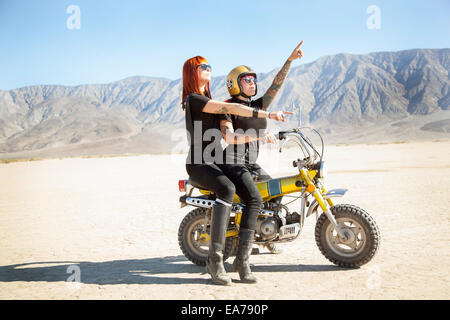 Women on motocross in desert Stock Photo