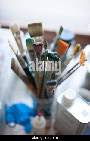 Overhead view of paintbrushes stored in jar Stock Photo