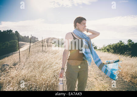 Woman standing and looking at view Stock Photo