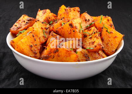 Jeera Aloo - Potatoes Flavoured With Cumin is a hot and spicy accompaniment for curry can be eaten as a snack with bread,paratha Stock Photo