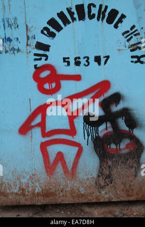 red funny man draw on blue metal bin Stock Photo