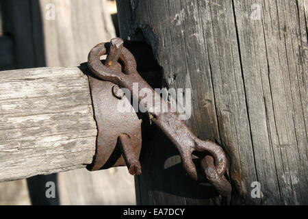 Closeup old metal parts on the fence Stock Photo