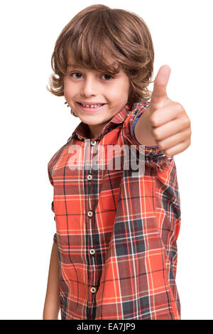 Cool young boy doing thumbs up over white Stock Photo