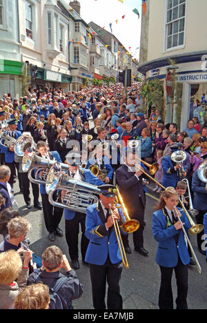 The Principal Dance of The Day being led down Maneage Street to the Guildhall by The Helston Town Band on Flora Day in Helston K Stock Photo