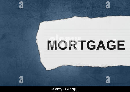 mortgage with white paper tears on blue texture Stock Photo