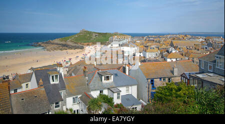 Panoramic view across houses to Porthmeor Beach and St Ives Head on a Sunny summers afternoon St Ives Penwith West Cornwall Sout