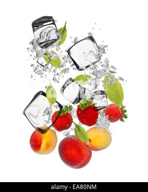 Falling pieces of apricots, strawberries and nectarines in water splash and ice cubes, isolated on white background Stock Photo