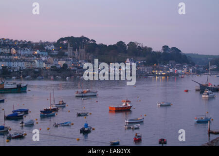 Dusk view from Polruan looking across the River Fowey to the town of Fowey Caradon South East Cornwall South West England UK Stock Photo