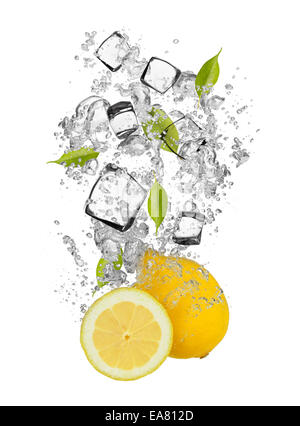 Falling pieces of lemons in water splash and ice cubes, isolated on white background Stock Photo