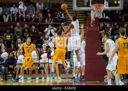 Charleston, SC, USA. 8th Nov, 2014. College of Charleston F/C Glen Pierre, Jr. (5) blocks a shot from Emory G Michael Florin (3) during the NCAA Basketball game between Emory University and the College of Charleston at TD Arena on November 8, 2014 in Charleston, South Carolina.College of Charleston defeats Emory 78-68. Credit:  Cal Sport Media/Alamy Live News Stock Photo