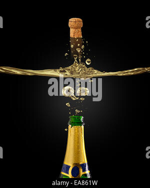 Bottle of champagne with flying cork in splash, isolated on black background Stock Photo