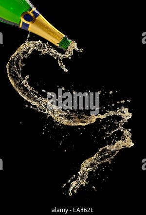 Bottle of champagne with splash on black background Stock Photo