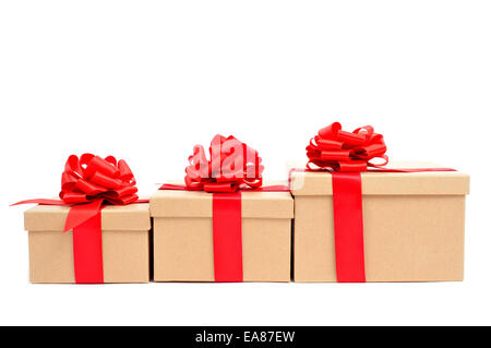 some gift boxes tied with red ribbon on a white background Stock Photo