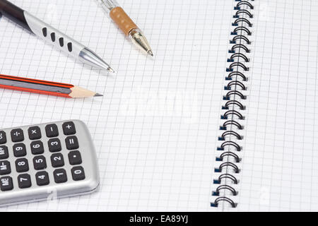 several pens and pencil on pad Stock Photo