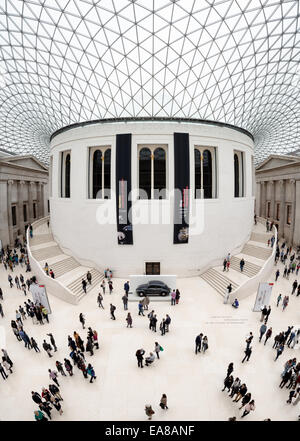 LONDON, United Kingdom — The Queen Elizabeth II Great Court at the British Museum. This expansive public square, designed by Foster and Partners, features a distinctive glass and steel roof made of 3,312 unique panes, and surrounds the historic Reading Room. Opened in 2000, it is the largest covered public square in Europe, serving as a central hub for visitors. Stock Photo