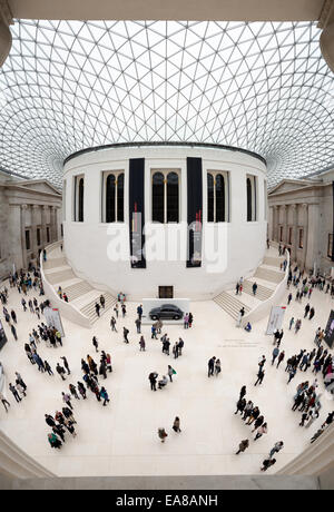 LONDON, United Kingdom — The Queen Elizabeth II Great Court at the British Museum. This expansive public square, designed by Foster and Partners, features a distinctive glass and steel roof made of 3,312 unique panes, and surrounds the historic Reading Room. Opened in 2000, it is the largest covered public square in Europe, serving as a central hub for visitors. Stock Photo