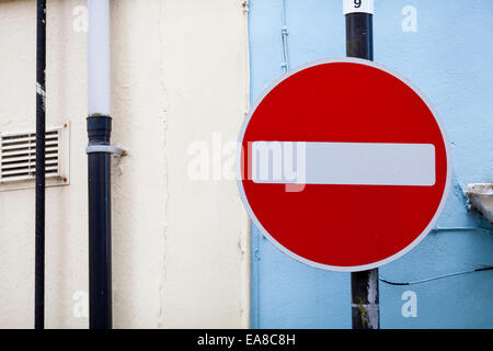 No entry sign against a blue wall, taken in Carmarthen, Carmarthenshire, South West Wales. Stock Photo