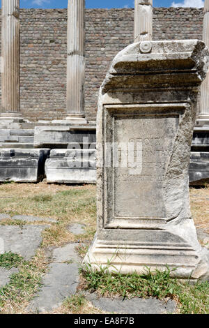 Column Pedestal with Greek inscription beside the sacred area North stoa of the Asklepieion. Ancient Pergamum, Bergama, Turkey. Stock Photo