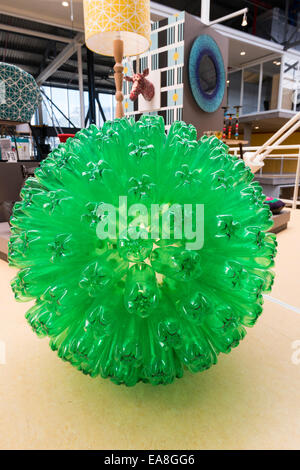 Recycled green plastic bottles arranged to form a spherical lamp, showcase at an exhibition in Cape Town, South Africa Stock Photo