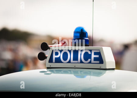 Vintage retro police sign on car roof with light and horn Stock Photo