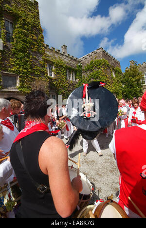 Close up of band red Oss & dancers outside Prideaux House Prideaux Place in Padstow on the first of may Obby Oss day North Cornw Stock Photo