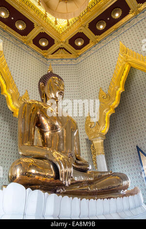 Statue Of Buddha Made Of Pure Gold Surrounded By Flowers And Offerings ...