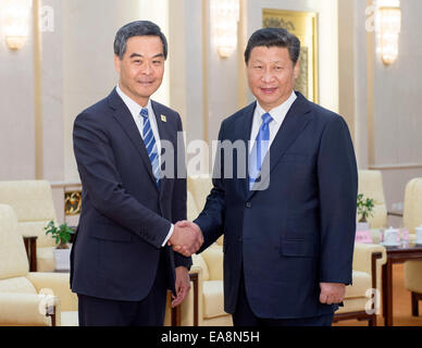 Beijing, China. 9th Nov, 2014. Chinese President Xi Jinping (R) meets with Leung Chun-ying, Chief Executive of China's Hong Kong SAR, in Beijing, China, Nov. 9, 2014. Leung is in Beijing to attend the 22nd Asia-Pacific Economic Cooperation (APEC) Economic Leaders' Meeting which will be held in Beijing from Nov. 10 to 11. Credit:  Xie Huanchi/Xinhua/Alamy Live News Stock Photo