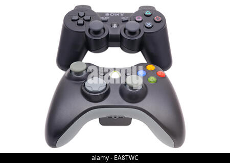 BARCELONA, SPAIN - APR 18, 2014: The controllers of Xbox 360 and Playstation 3. Stock Photo