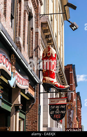 Large overhead neon sign above the strip on Broadway in Nashville Tennessee Stock Photo