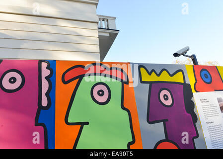 Belgrave Square, London, UK. 9th November 2014. 25 years after the fall of the Berlin Wall, artist Thierry Noir re-creates the art he painted on the actual wall in the 1980s. Credit:  Matthew Chattle/Alamy Live News Stock Photo