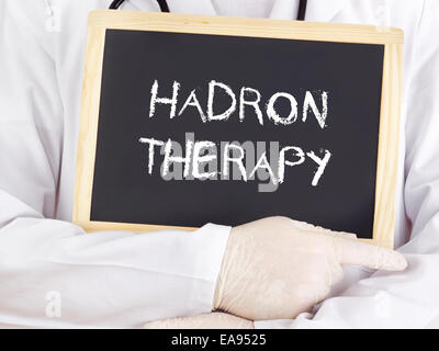 Doctor shows information: hadron therapy Stock Photo