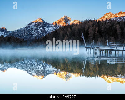 Autumn reflections on the lake Lej da Staz, Engadine Saint Moritz, Switzerland Stock Photo