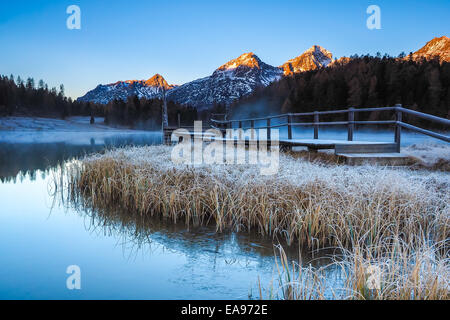 Autumn reflections on the lake Lej da Staz, Engadine Saint Moritz, Switzerland Stock Photo