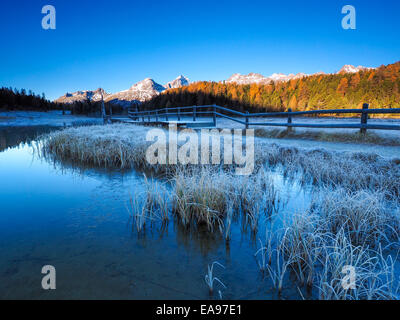 Autumn reflections on the lake Lej da Staz, Engadine Saint Moritz, Switzerland Stock Photo