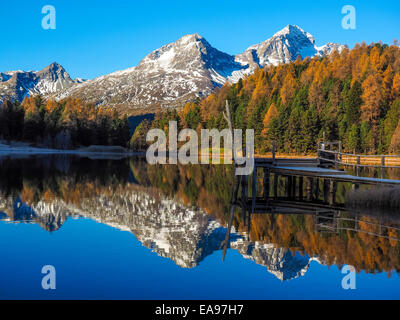 Autumn reflections on the lake Lej da Staz, Engadine Saint Moritz, Switzerland Stock Photo