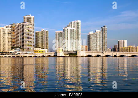 The historic Venetian Causeway bascule bridge arches it's way across Biscayne Bay with the Miami skyline beyond, Florida, USA. Stock Photo