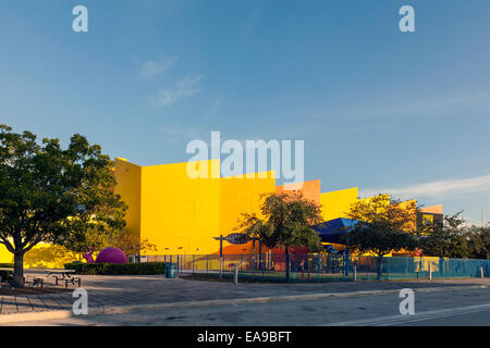 Brightly coloured colored Miami's Children's Museum fenced playground with shade awning in Miami Florida, USA. Stock Photo