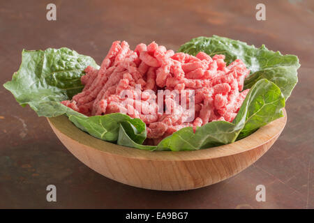 Closeup of bowl full of raw red lean ground meat beef Stock Photo