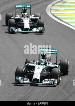 Mercedes drivers Lewis Hamilton (front) and George Russell during the ...