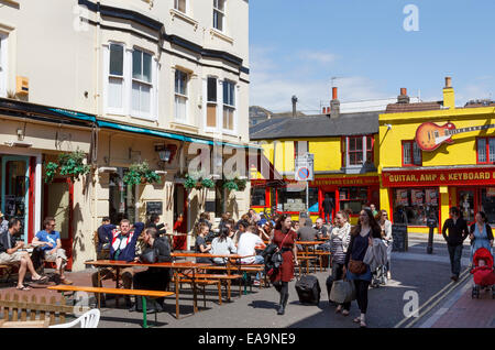 People sitting in the sun outside The Dorset pub in the the trendy North Laine district of Brighton. Stock Photo