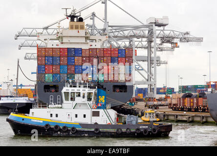 Stacks of shipping containers piled up on a container ship in the Port of Rotterdam,  The Netherlands. Rotterdam is Europe's big Stock Photo