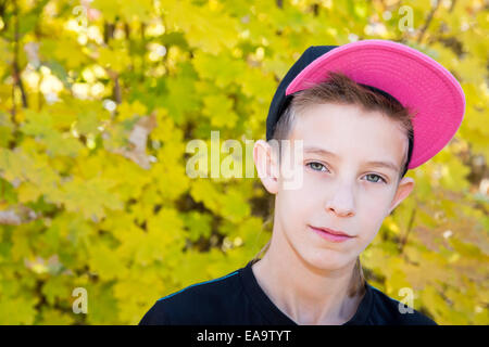 Fall. boy teenager  with leaves in autumn park Stock Photo