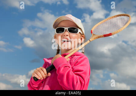 little girl with racket for badminton