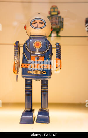 Vintage tin toy robots on display, featuring retro colours, wind-up mechanisms, and classic sci-fi design Stock Photo