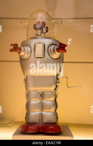 Vintage tin toy robots on display, featuring retro colours, wind-up mechanisms, and classic sci-fi design Stock Photo