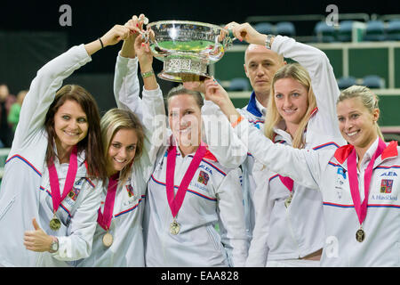 Prague, Czech Republic. 09th Nov, 2014. Czech Republic's (L-R) Lucie Safarova, Klara Koukalova, Lucie Hradecka, head coach Petr Pala, Petra Kvitova and Andrea Hlavackova pose with the trophy after beating Germany in the Tennis Fed Cup World Group Final in Prague, Czech Republic, 09 November 2014. Photo: Daniel Karmann/dpa/Alamy Live News Stock Photo