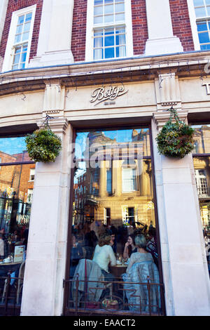 Betty's tea room York City sign name customers eating centre Bettys shop outside building exterior deli food restaurant cafe UK Stock Photo