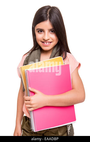 Beautiful little girl holding sketchbooks over white Stock Photo