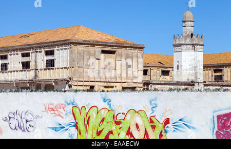 Tangier, Morocco - March 23, 2014: Abandoned buildings with mosque near the avenue Mohammed VI in Tangier city, Morocco Stock Photo